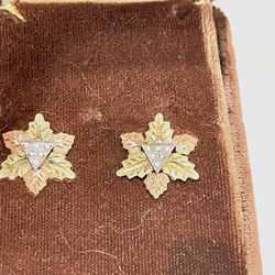 Vintage like new solid, gold leaf design earrings with six diamonds in each earring