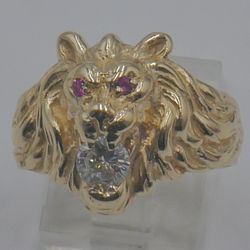 14kt yellow gold ring size 8.5; 10.5 grams ; 2 red stones ;1 diamond 0.50 SI1 clarity G color. 869047-1