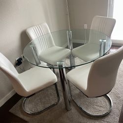 Round Glass Dining Table with 4 White Chairs
