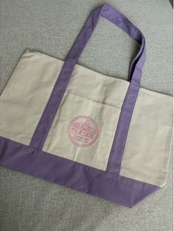 large purple trader joe’s tote bag