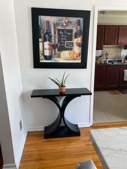 Black Console Table with Curved Base + Picture