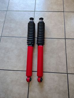 Red Absorbers Pair with Boot Covers shocks (Part#PA692410-F08)(see description)