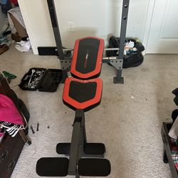 Weight Bench, Barbell, And Plates