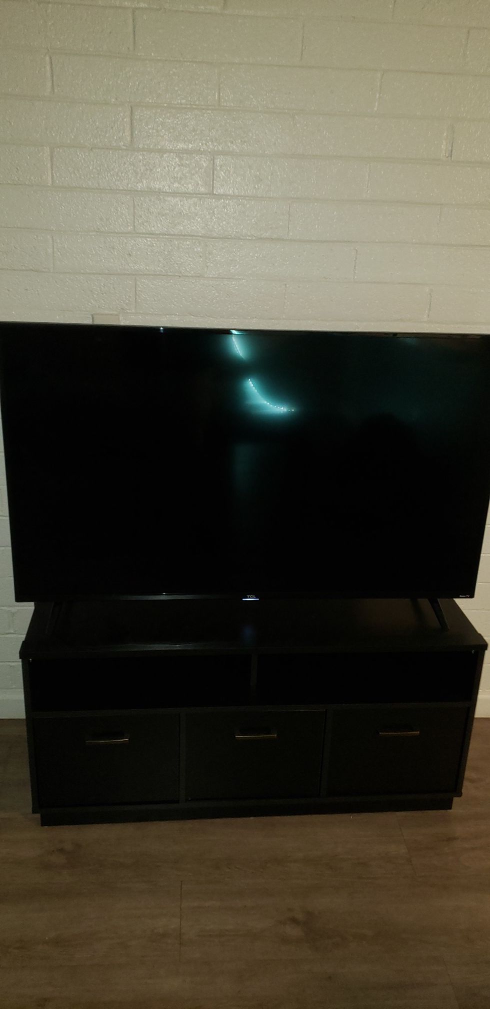 Roku 55 inch TV with TV stand