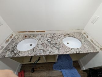Granite bathroom countertop including sinks