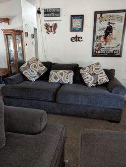 4 piece couch set. 2 love seats with an ottoman