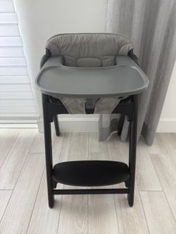 Like new momcozy dinerpal high chair and soft cushion black