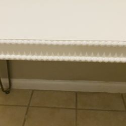 Cute beaded edge table.