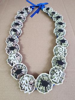 Boy's money lei with cap and year