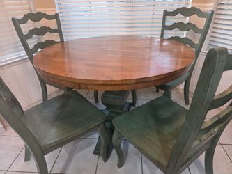 Round wood dining table and chairs.