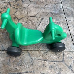 Small Green Plastic Ride On or Push Toy