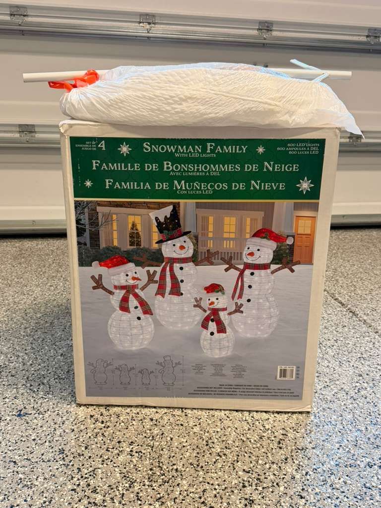 Set of 4 snowmen with LED lights, perfect for holiday decoration.