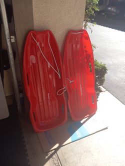 2 Red Snow Sleds