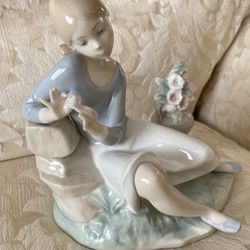 Lladro Nostalgia Girl w/Flowers Glossy Porcelain. Was$350. Now… $105