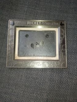 A Metal Frame Celebrate Mickey 75 Years Of Fun Coca Cola