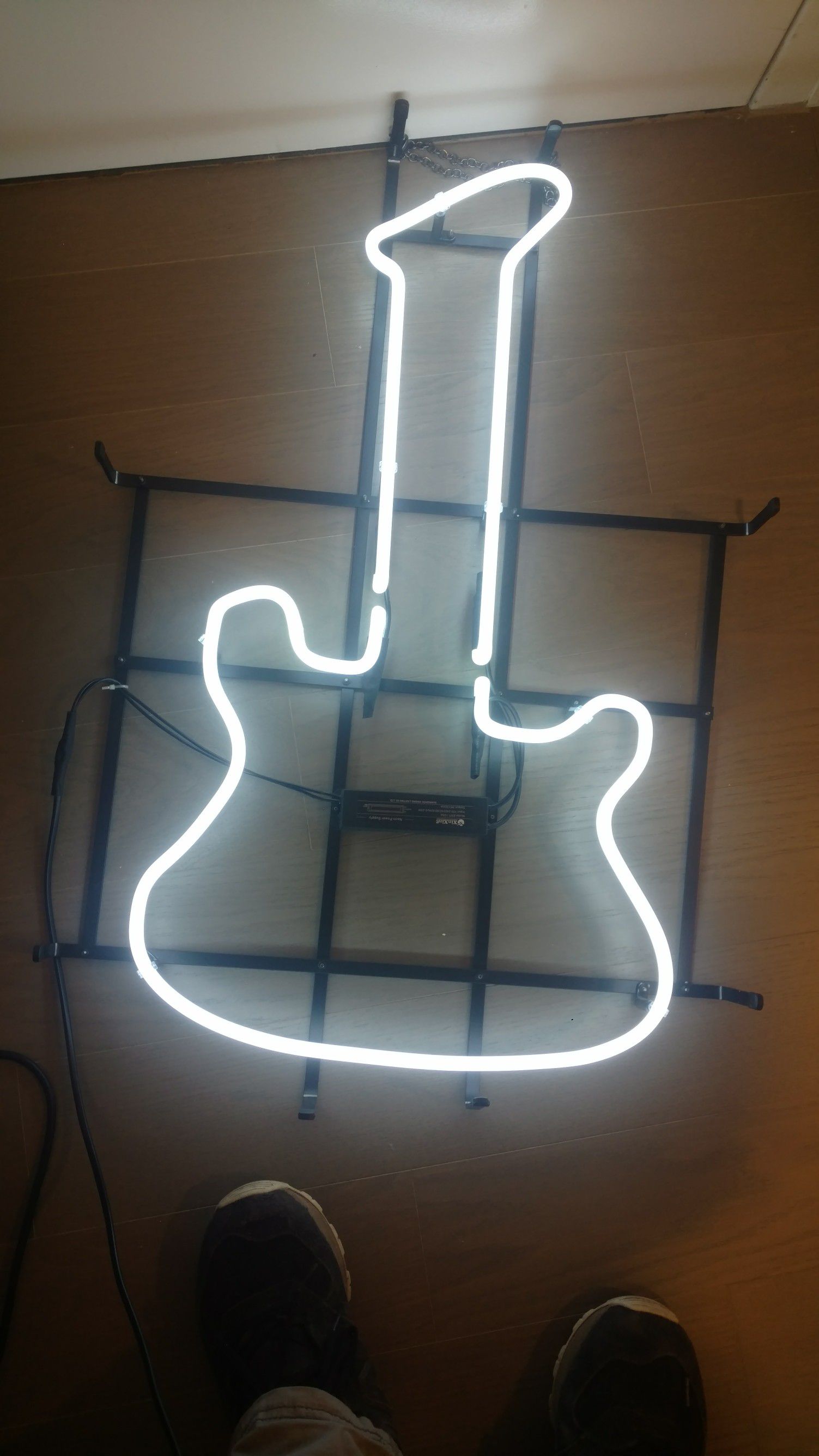 Guitar neon light. Stands at 2 n half ft tall. And is 2ft wide.