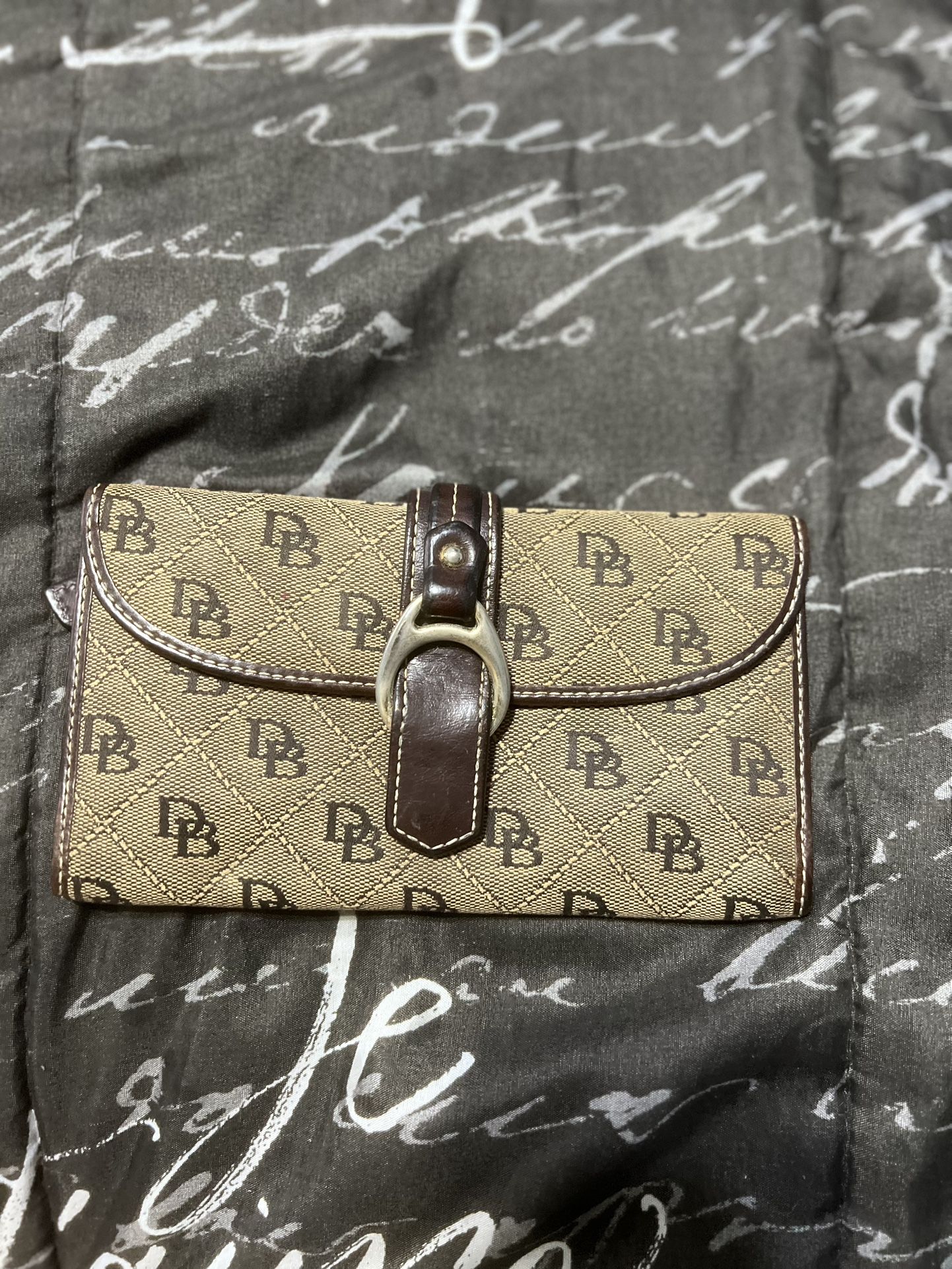 Dooney and Bourke- signature jacquard weave and leather trifold wallet