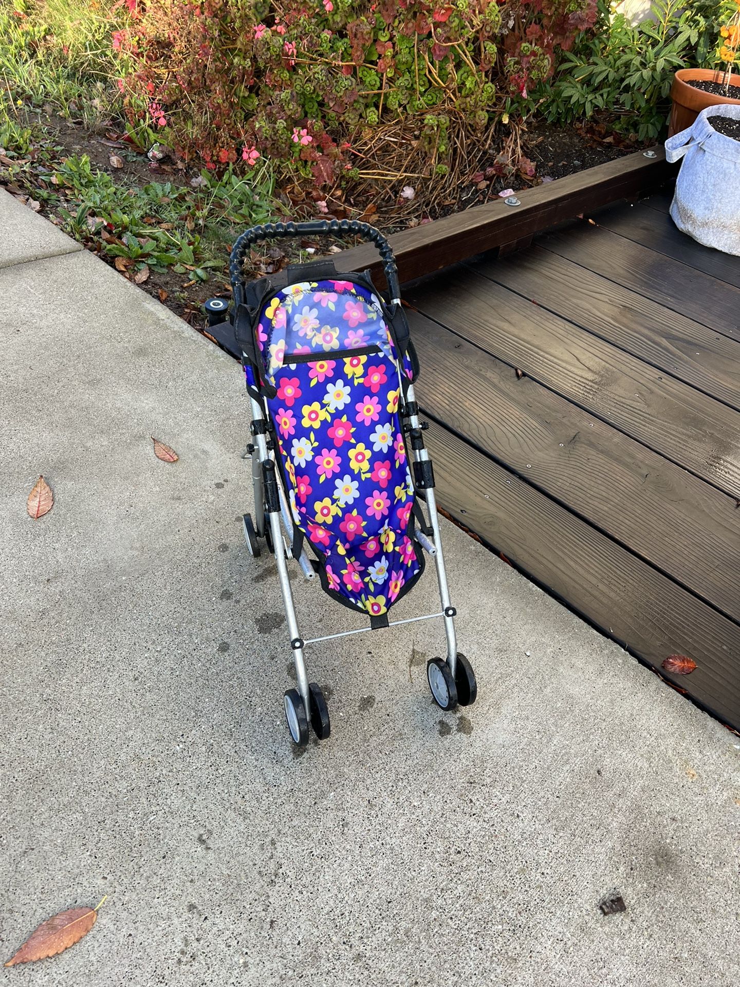 Girls folding toddler stroller