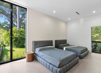 Two gray queen beds
