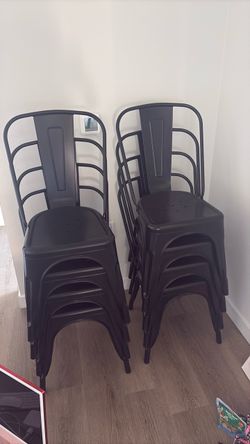 8 black metal stools