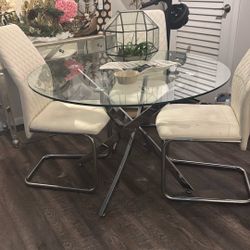 Glass Table Top, Crone Bottom With Four White Leather Chairs 