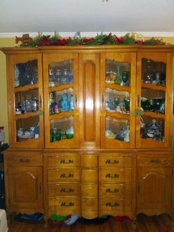 Beautiful Breakfront. Maple finish, beveled glass