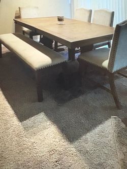 Nice table with four chairs and the sitting bench needs a little TLC selling Good for $70