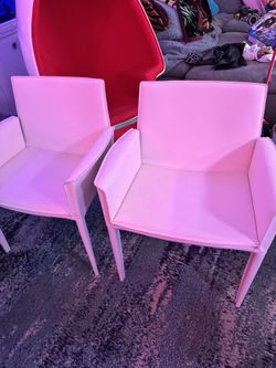 A Pair of White Leather Arm Chairs