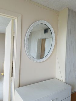 White oval mirror