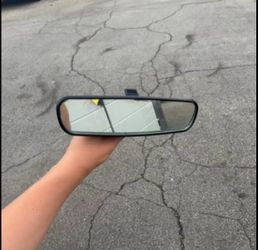 a replacement car rear view mirror featuring a black plastic housing