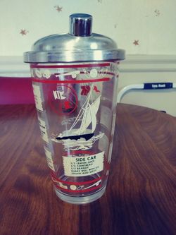 Vintage cocktail shaker with recipes