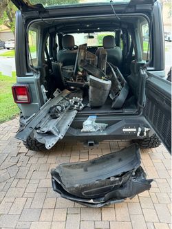 Jeep Wrangler JL 2025 stock front and rear bumpers, fender flares, and fender liners