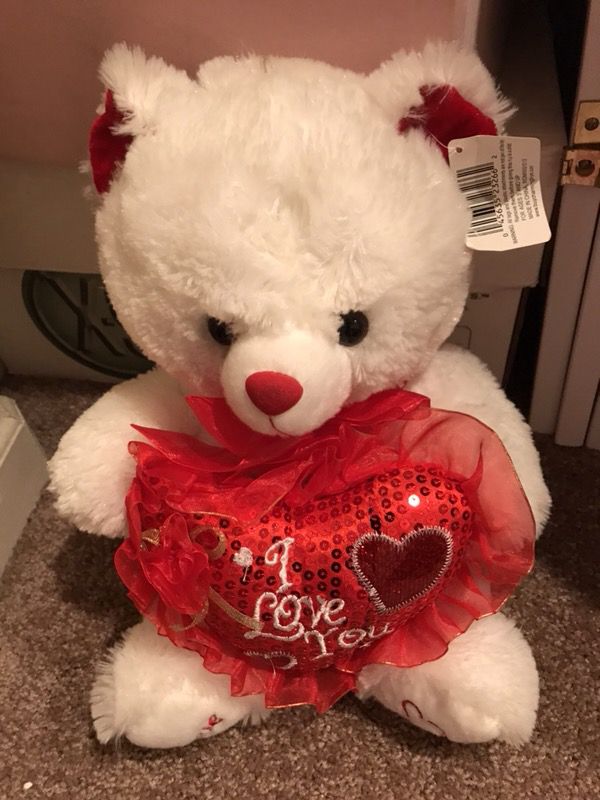 Stuffed bear with I love you heart with tag