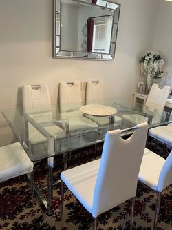 Glass dining table and 8 bonded leather chairs