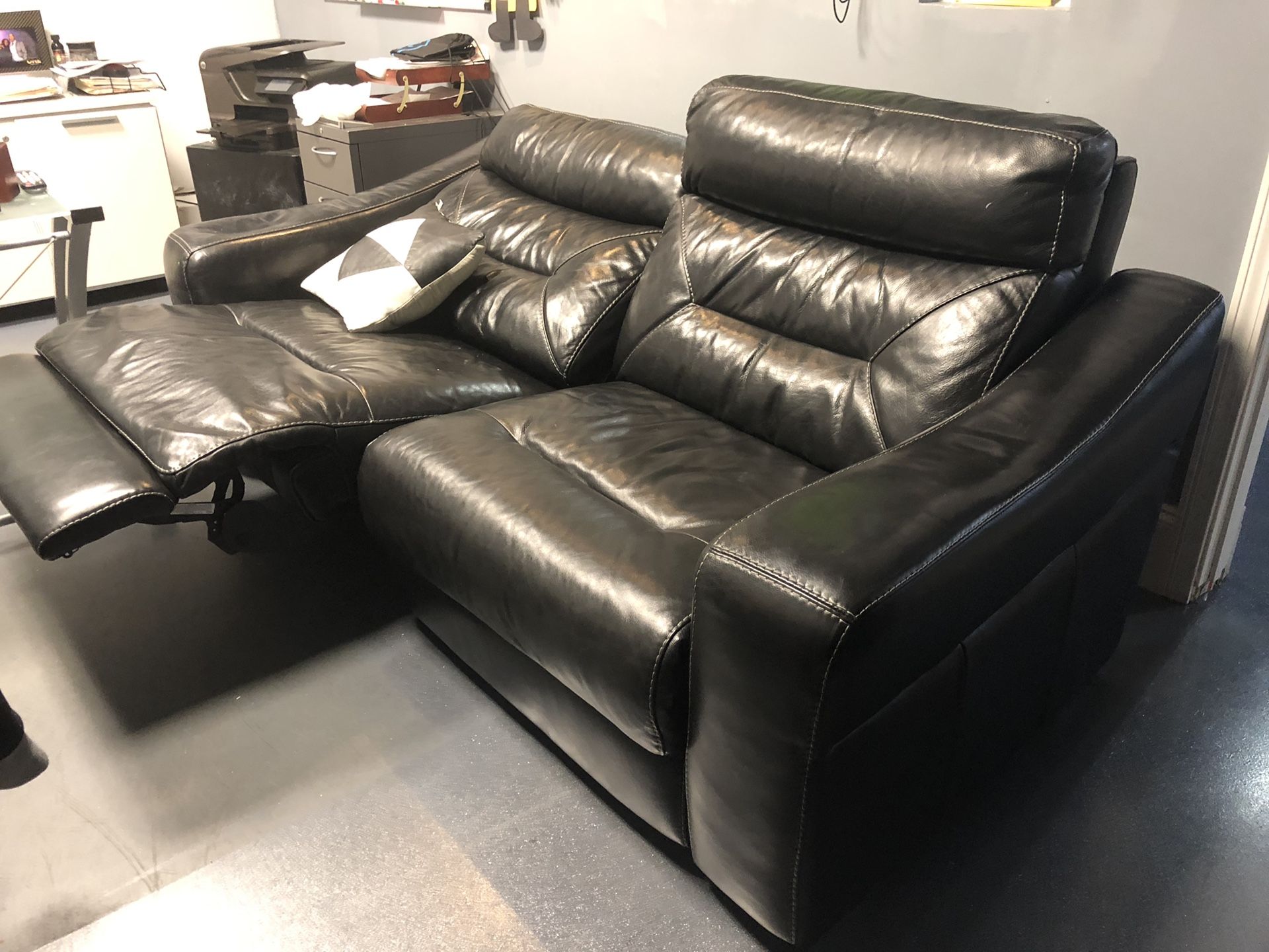 Powered leather reclining loveseat