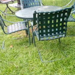 Give pc  Green Outdoor Patio Set, Four Iron Chairs Glass Table Top.. Good Condition.