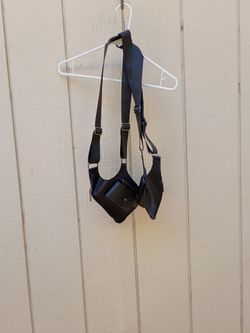 This black Atorse double shoulder armpit bag is designed for durable