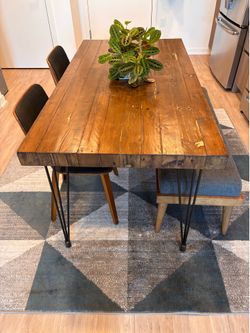 Sturdy wooden table with bench + two chairs