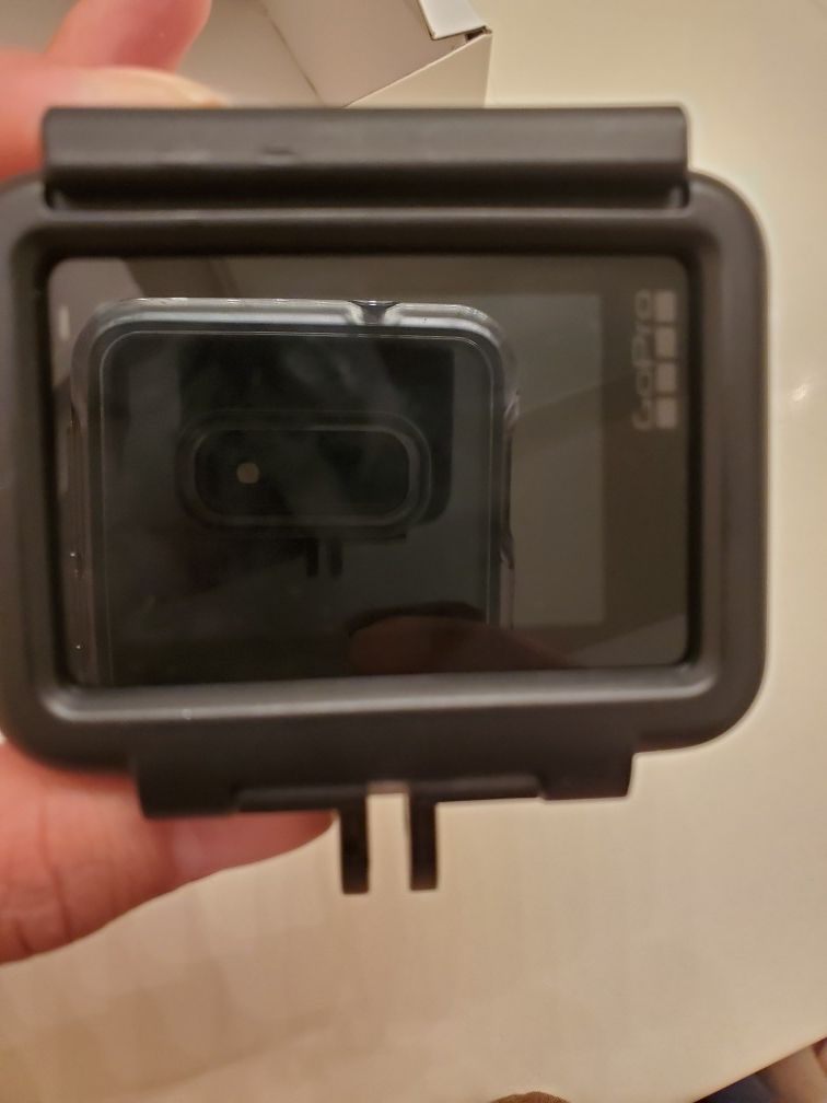 New go pro 7 black with case and tripod