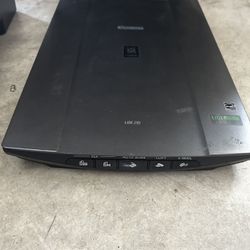 Canon LiDE 210 flatbed scanner with PDF, Auto Scan, Copy, and Email functions.