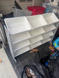 Toy storage and electric Cocomelon car