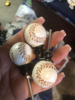 3 baseball knobs.
