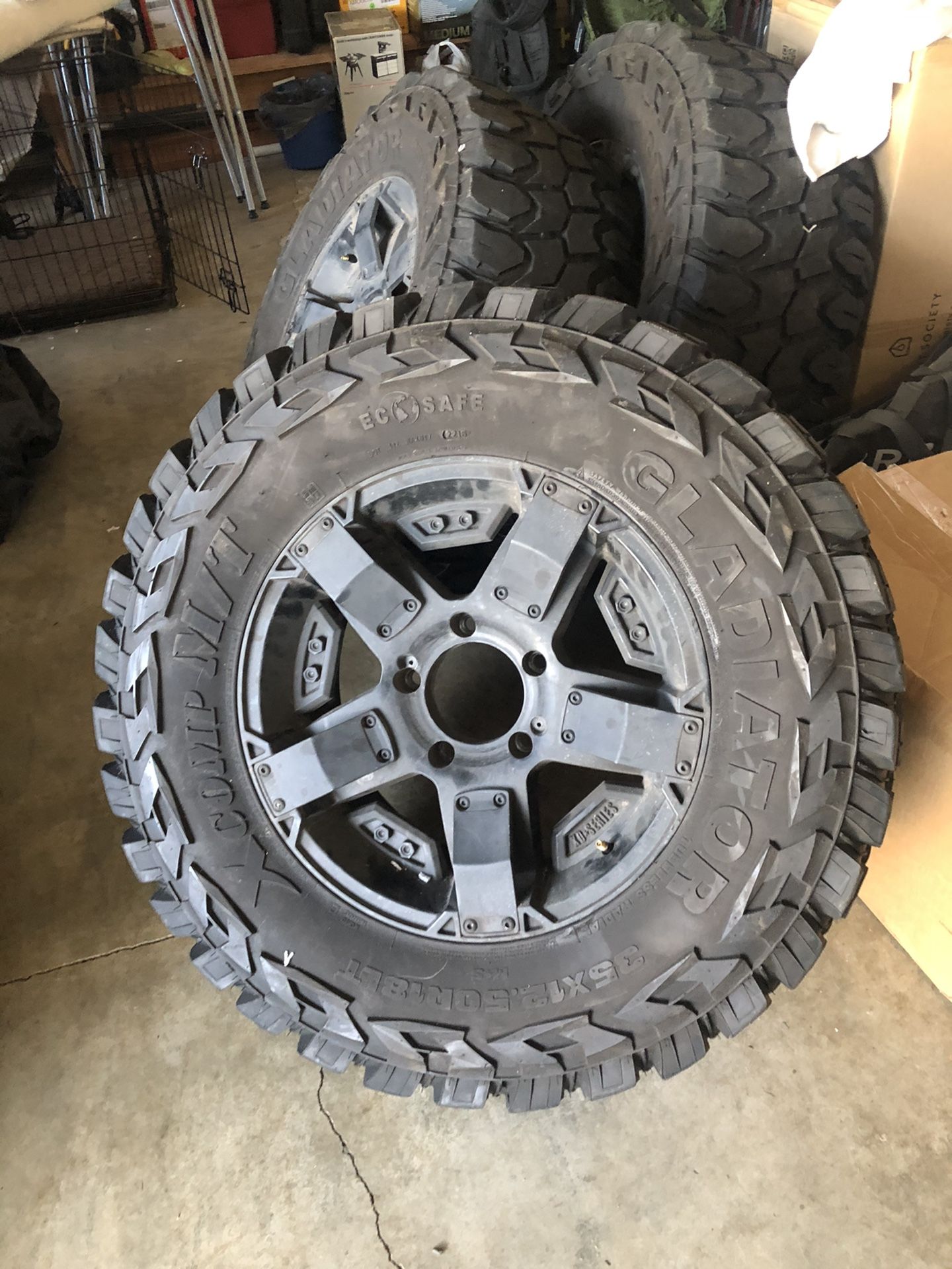 18 inch Rockstar’s on 35x12.5x18 Gladiator M/T tires. These are MEAN aggressive tires and wheels for $1100 tires with plenty of tred. 10/32 tred app