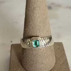 Size 10 Sterling Silver Ring with a Colombian Emerald. Available in Coral Gables.
