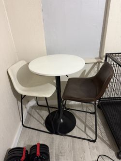 Small round café table with 2 chairs