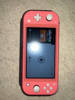 Nintendo switch lite in pink.
