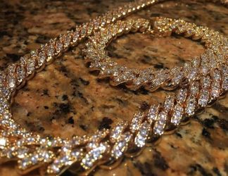 New 18 k yellow gold Cuban link chain and bracelet