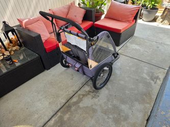Attached to bicycle or used as a push stroller