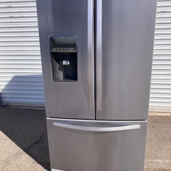 Whirlpool stainless steel refrigerator with French doors, in good condition, clean and attractive, with a one-month warranty and delivery service avai