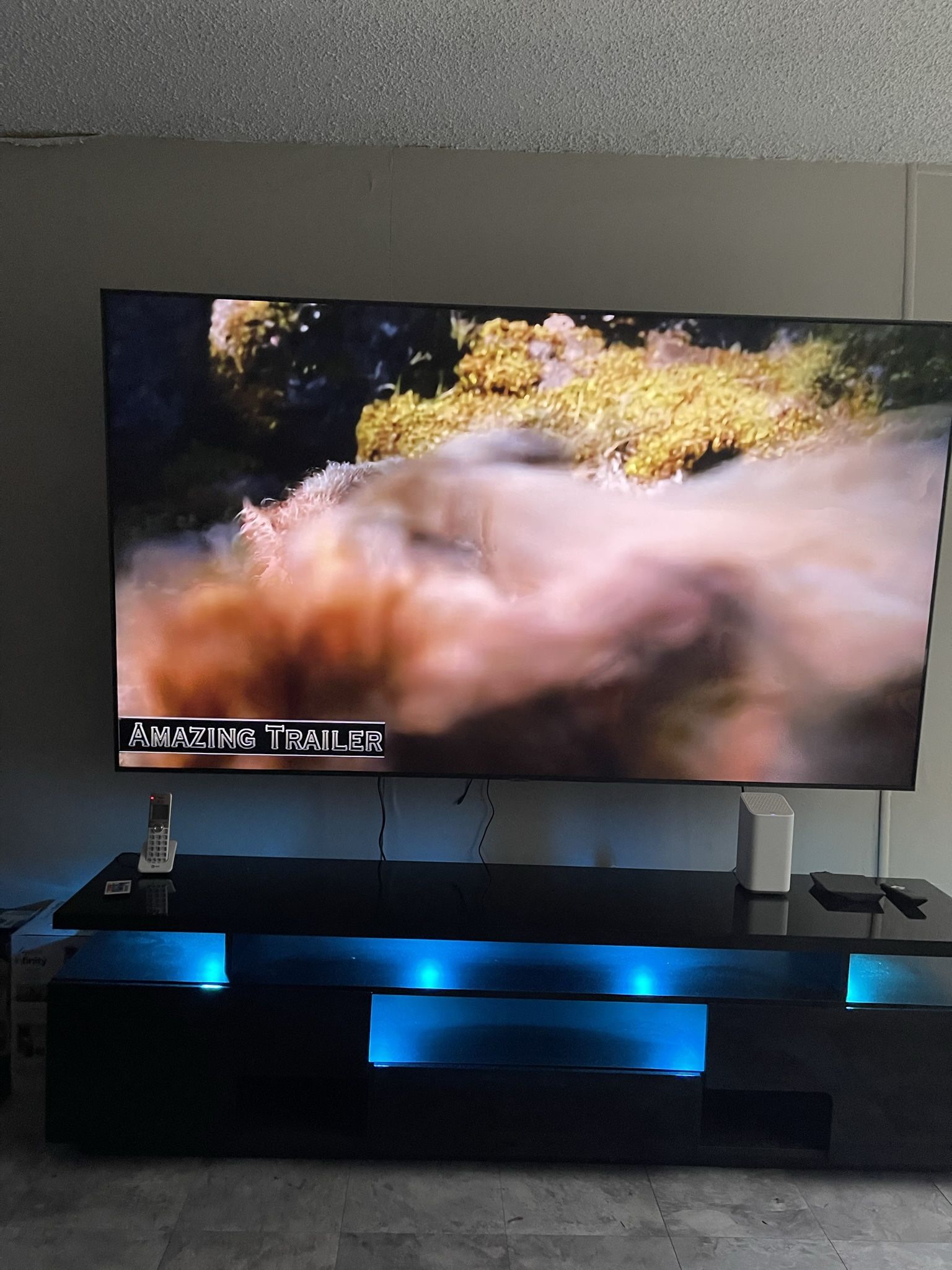 LG 75” Class UQ8000 Series Big screen and MEBLE FURNITURE EVA TV STAND with Extended TV wall mount w/ articulating dual swivel arms